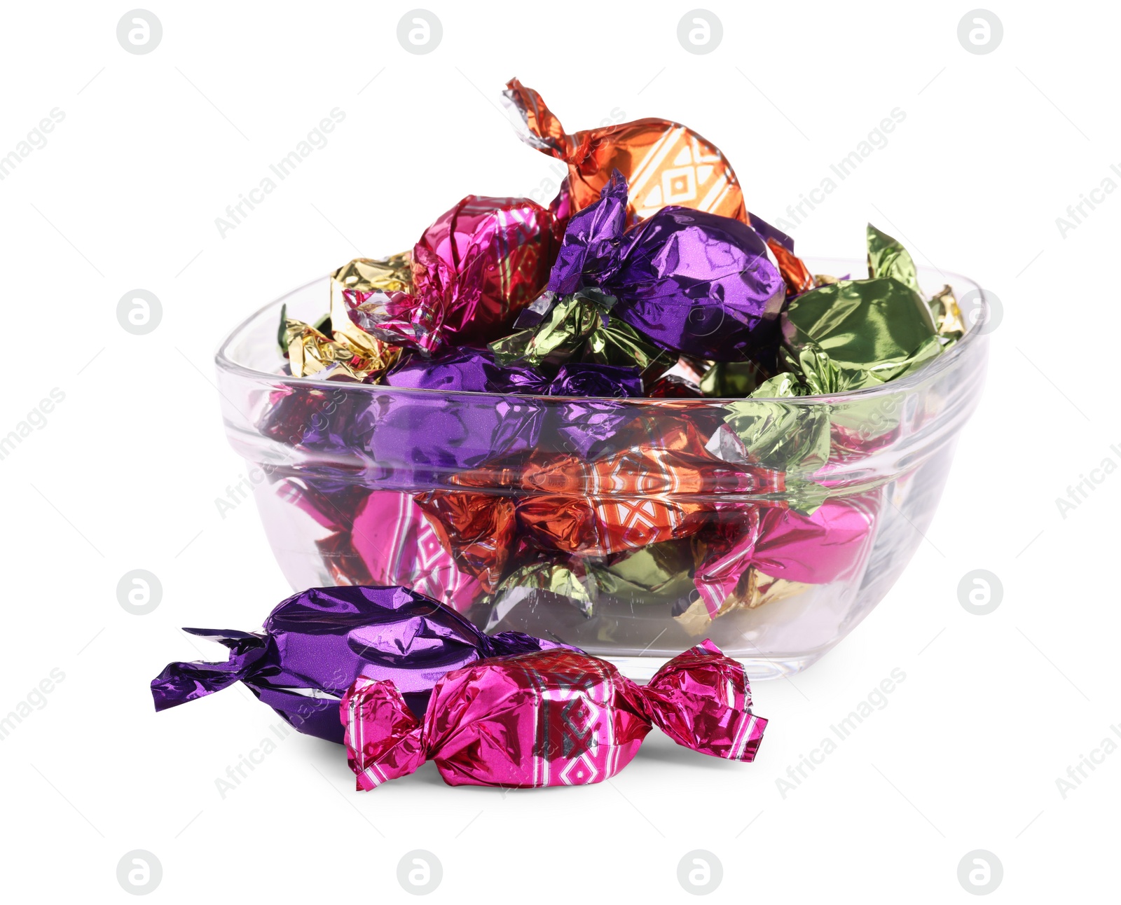 Photo of Bowl with candies in colorful wrappers isolated on white