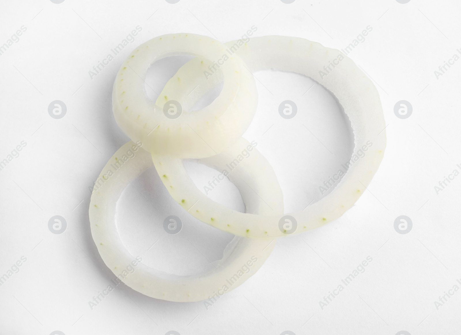 Photo of Fresh raw onion rings on white background