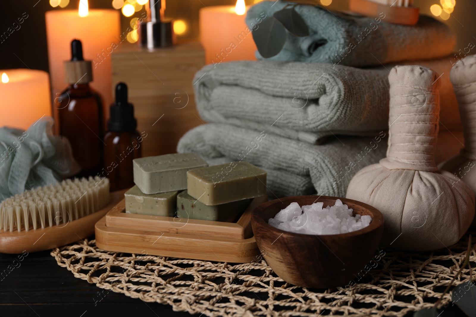 Photo of Beautiful composition with different spa products on table against blurred lights