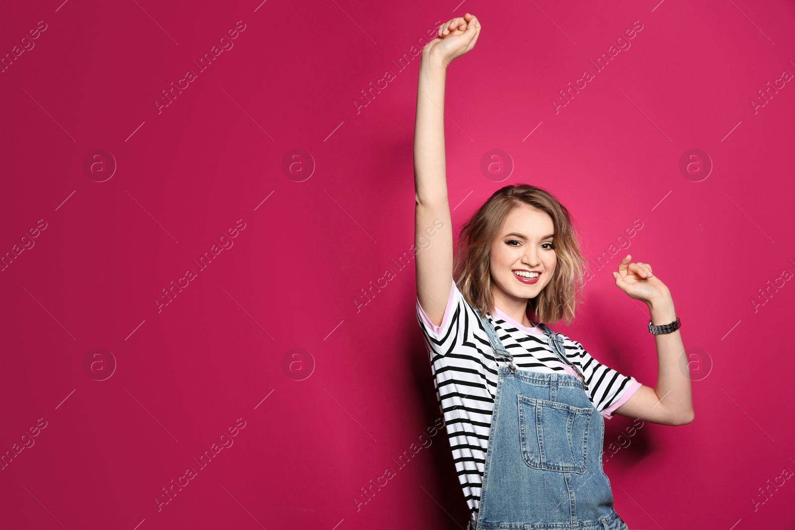 Photo of Beautiful young woman posing on color background