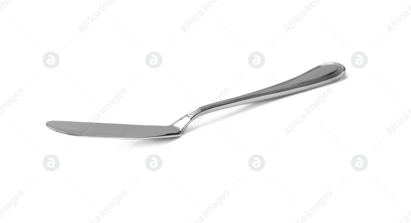 Photo of New metal butter knife isolated on white