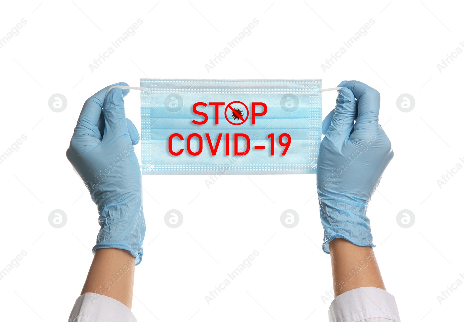 Image of Doctor holding medical mask with text Stop Covid-19 on white background, closeup. Protective measures during pandemic
