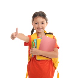 Cute child with school stationery on white background