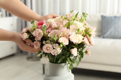 Photo of Woman with beautiful bouquet of fresh flowers at home, closeup