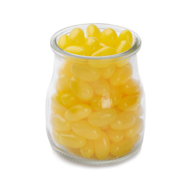 Photo of Tasty small lemon drops in glass jar isolated on white