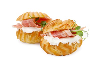Photo of Delicious profiteroles with cream cheese and prosciutto isolated on white