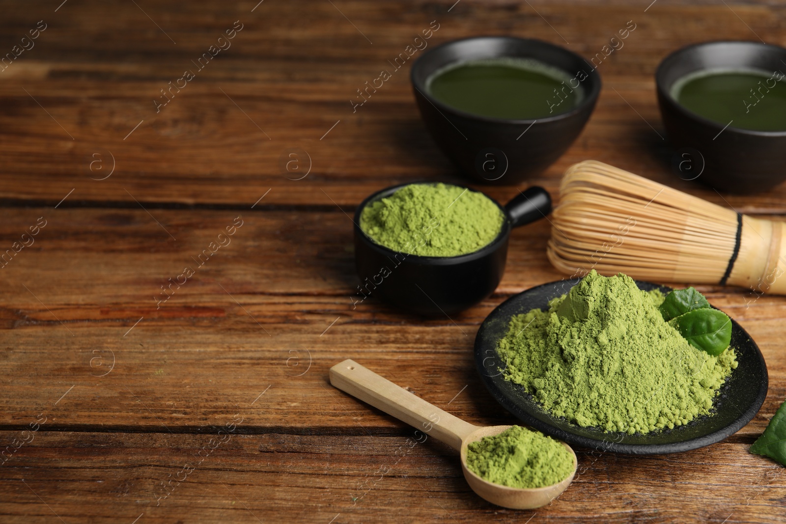 Photo of Composition with green matcha powder on wooden table, space for text