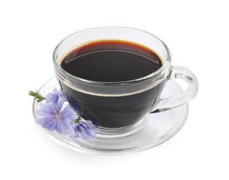 Glass cup of delicious chicory drink and flowers on white background