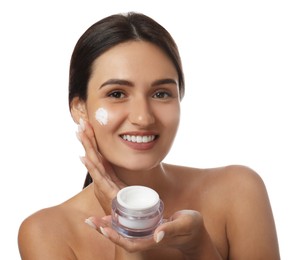 Photo of Young woman holding jar of facial cream on white background