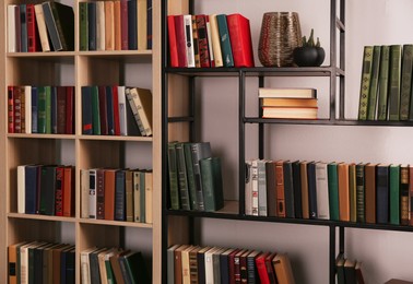 Collection of different books on shelves in home library