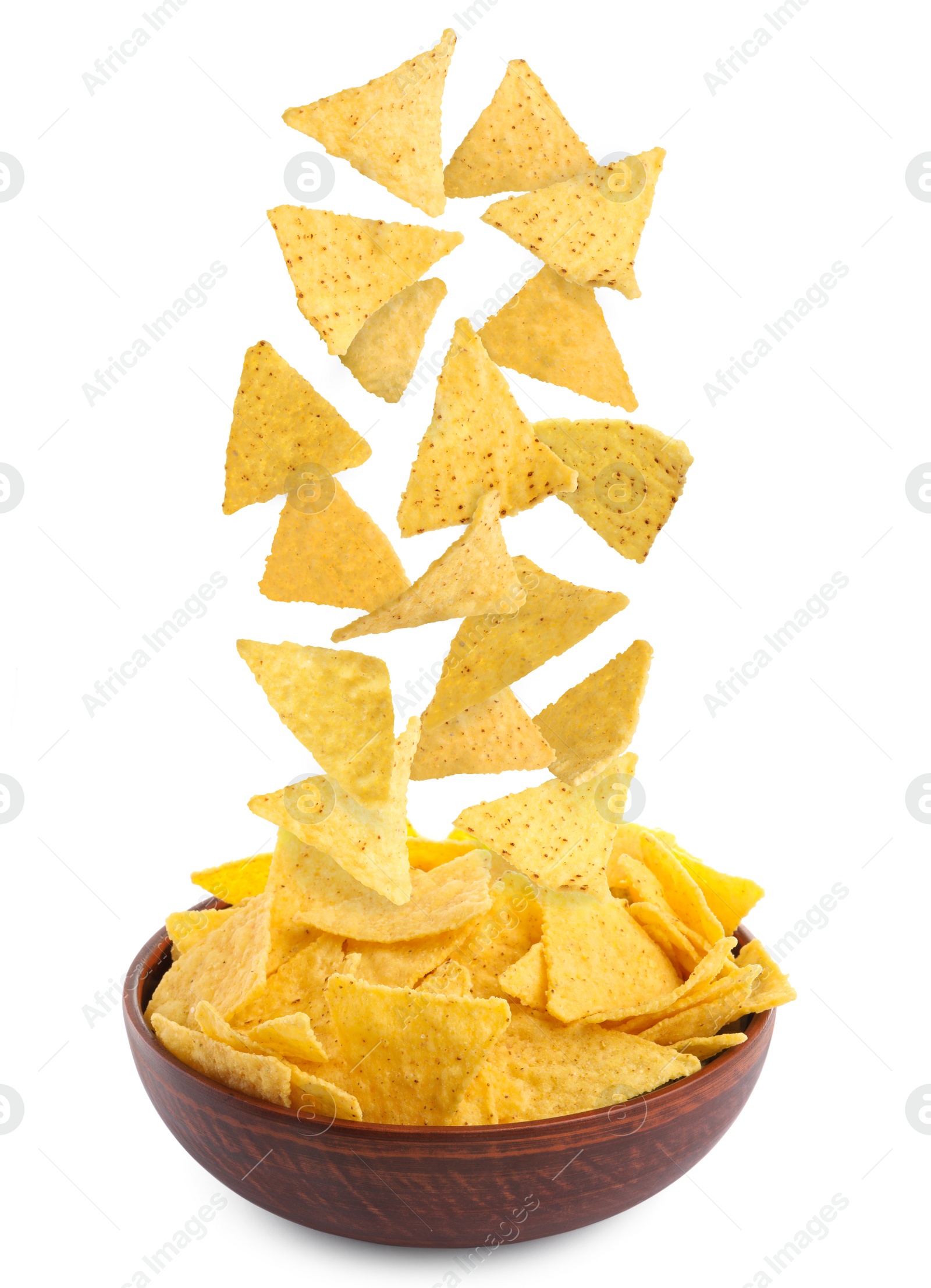 Image of Tasty tortilla chips (nachos) falling into bowl on white background