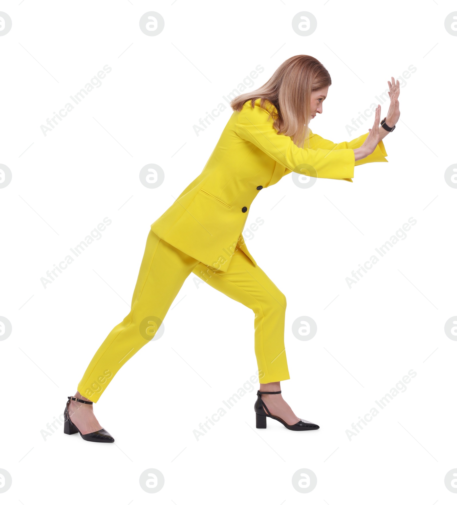 Photo of Beautiful businesswoman pushing something on white background