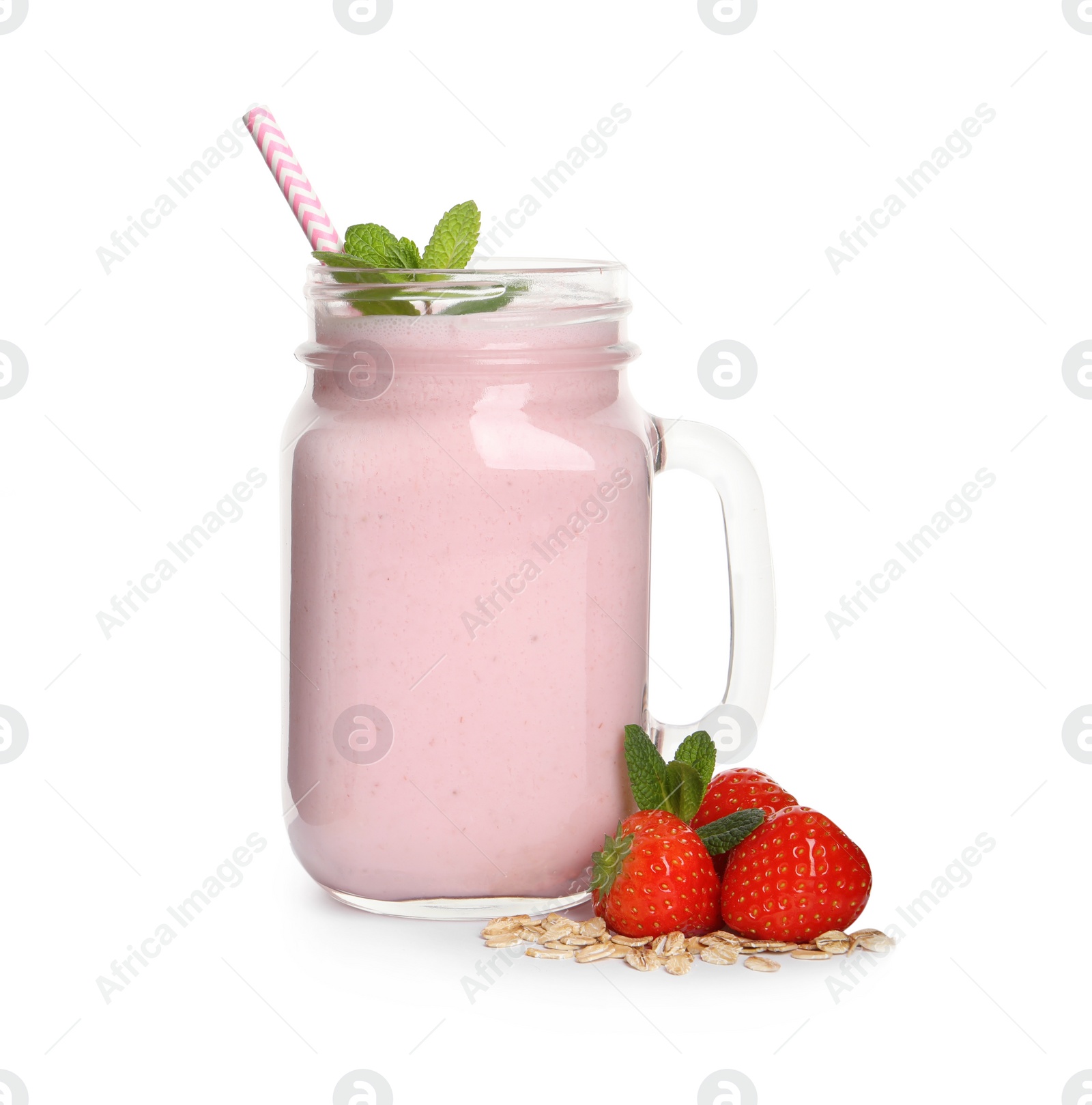 Photo of Mason jar of tasty strawberry smoothie with oatmeal, mint and fresh berries on white background