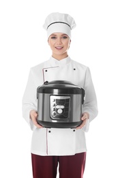 Female chef with modern multi cooker on white background