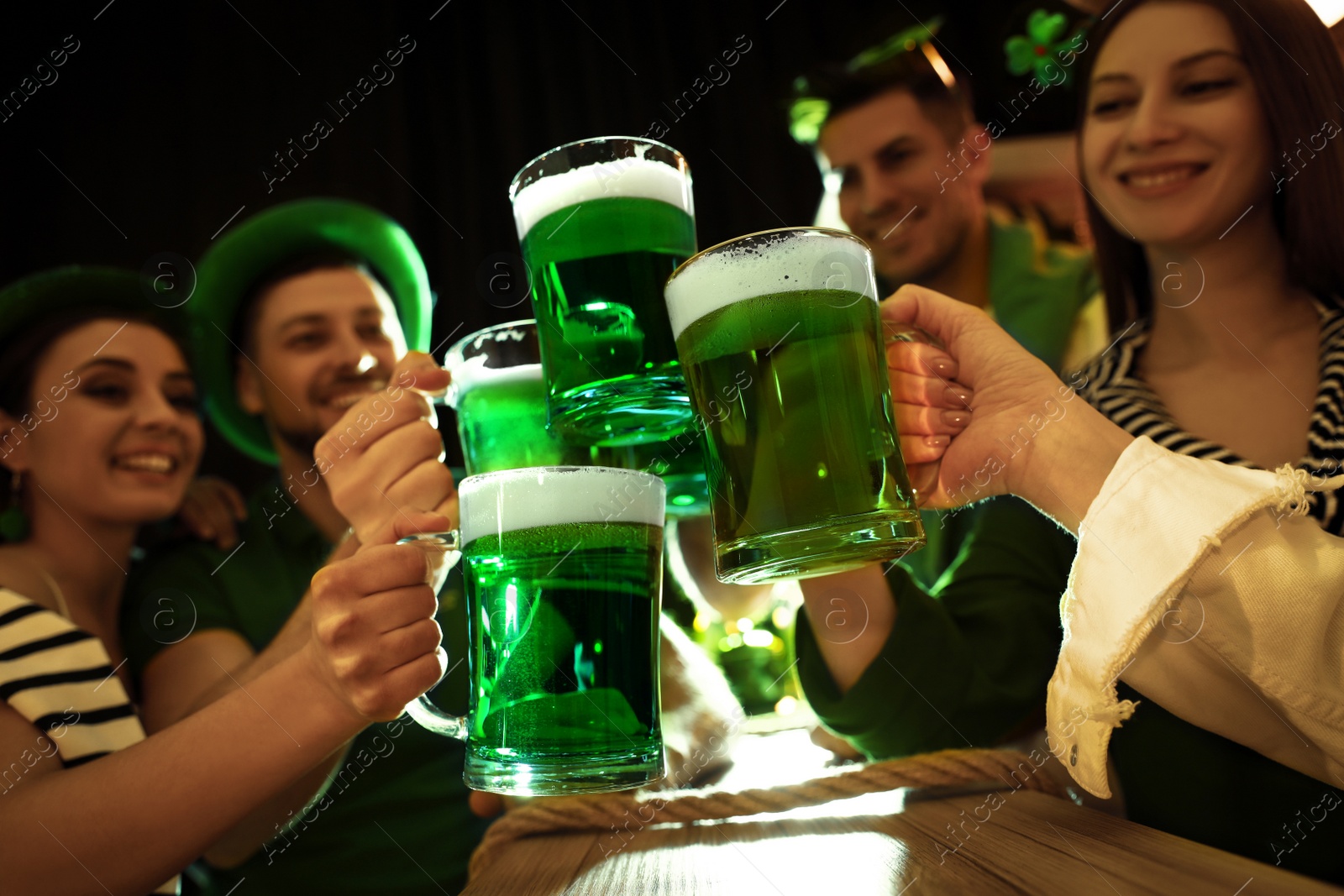 Photo of People with beer celebrating St Patrick's day in pub