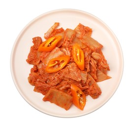 Plate of spicy cabbage kimchi with chili pepper isolated on white, top view