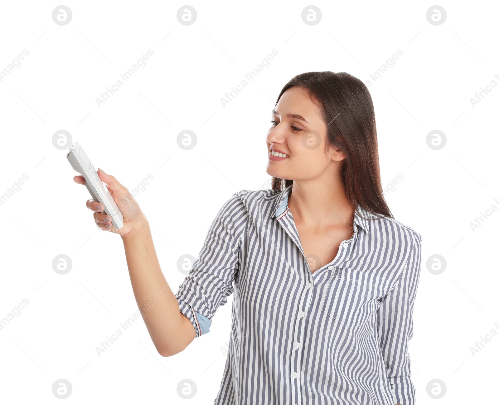 Photo of Happy young woman operating air conditioner with remote control on white background