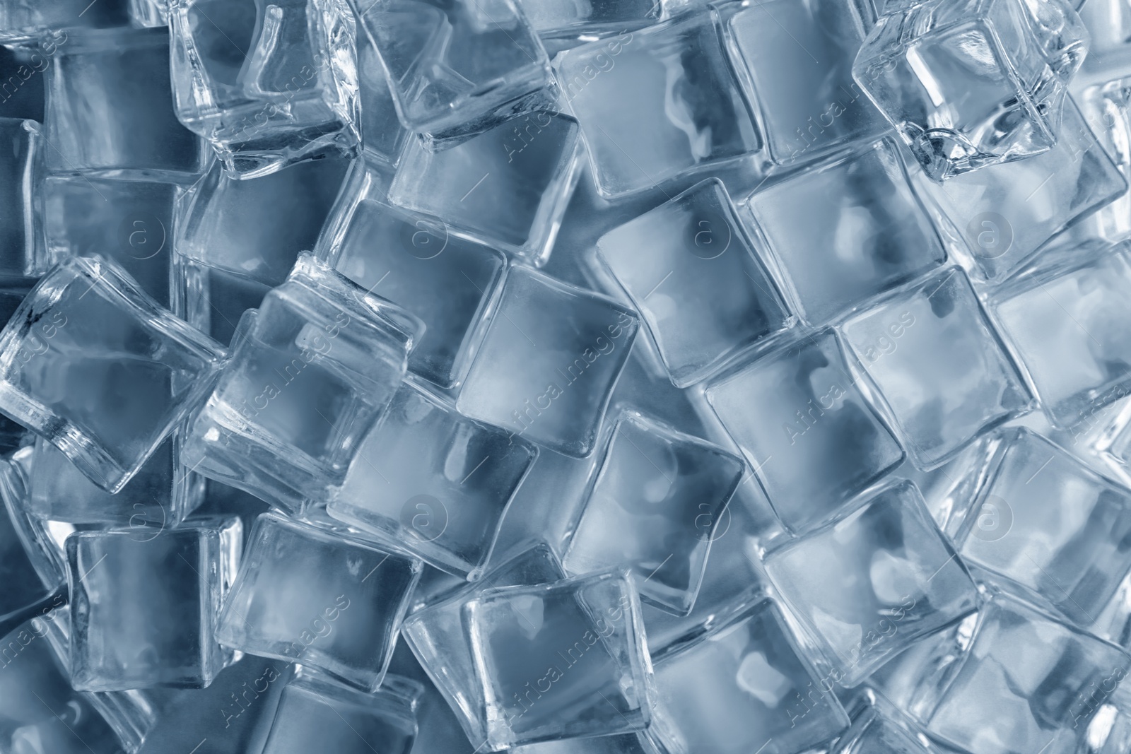 Photo of Crystal clear ice cubes as background, top view