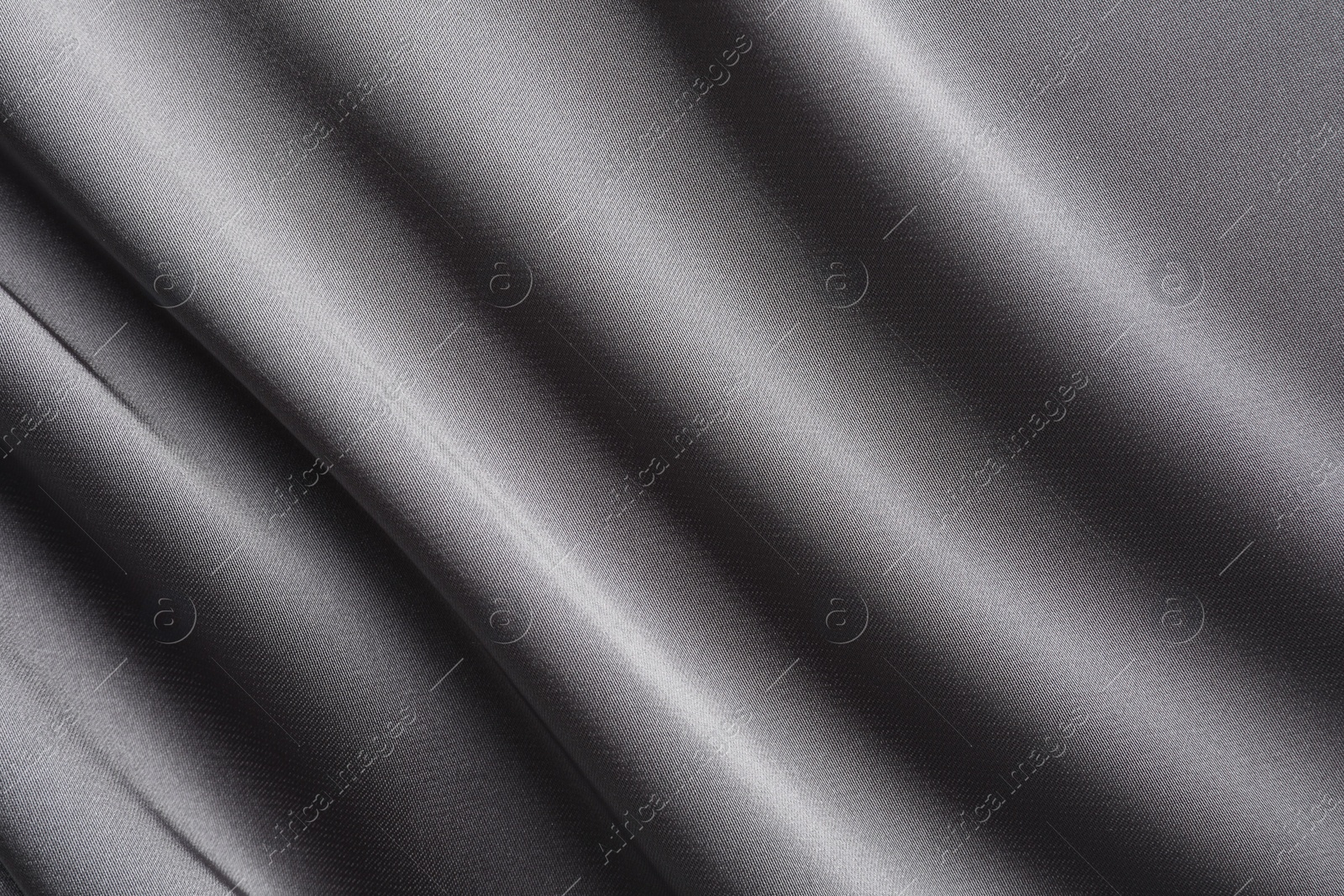 Photo of Texture of beautiful light grey silk fabric as background, closeup