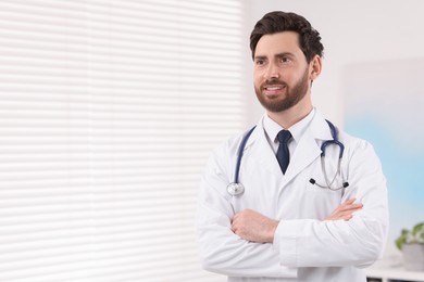 Photo of Medical consultant with stethoscope in clinic, space for text