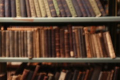 Photo of Blurred view of books on shelves in library