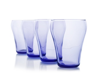 Photo of Empty elegant colorful glasses on white background