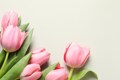 Photo of Happy Mother's Day. Beautiful tulips on light background, flat lay. Space for text