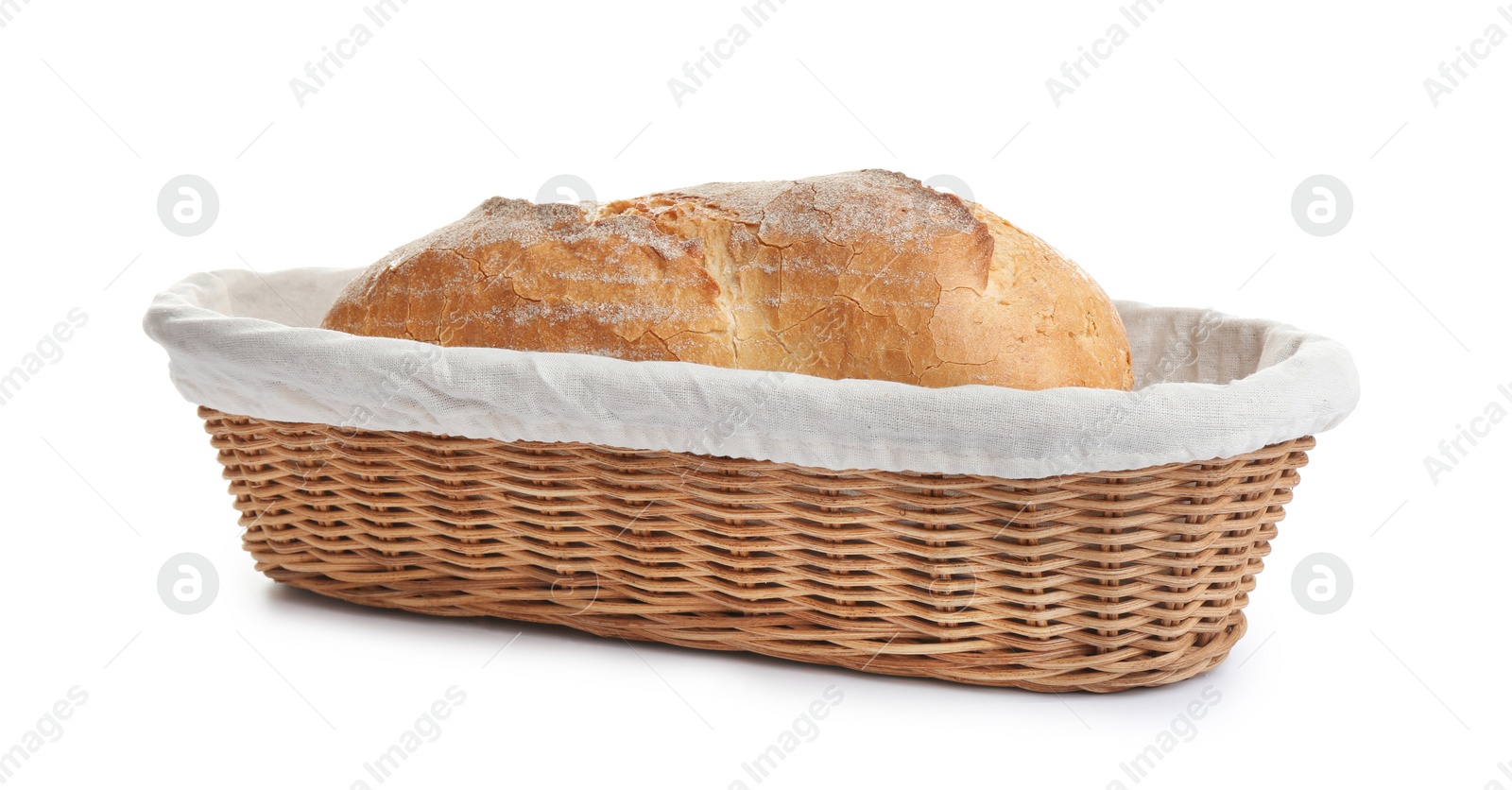 Photo of Loaf of tasty fresh bread in wicker basket on white background