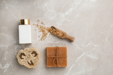 Photo of Flat lay composition with spa supplies on stone table