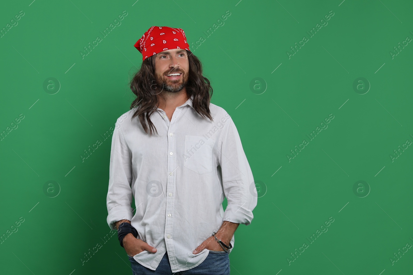 Photo of Stylish hippie man on green background, space for text