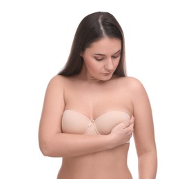 Photo of Mammology. Woman in bra doing breast self-examination on white background