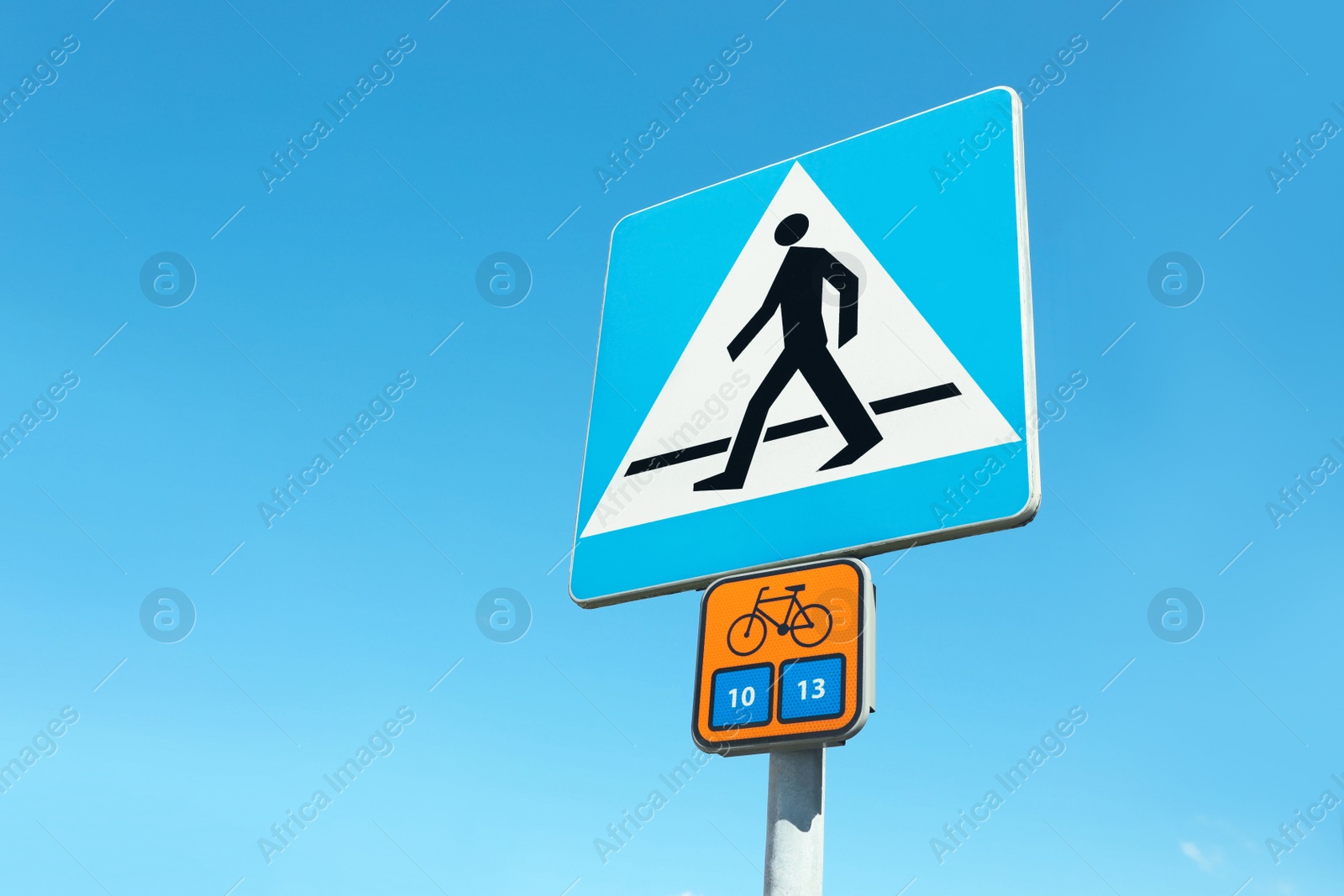Photo of Traffic signs Pedestrian crossing and Bicycle Route Information on city street, space for text