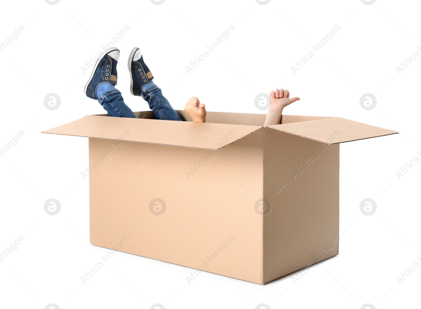 Photo of Cute little child playing with cardboard box on white background