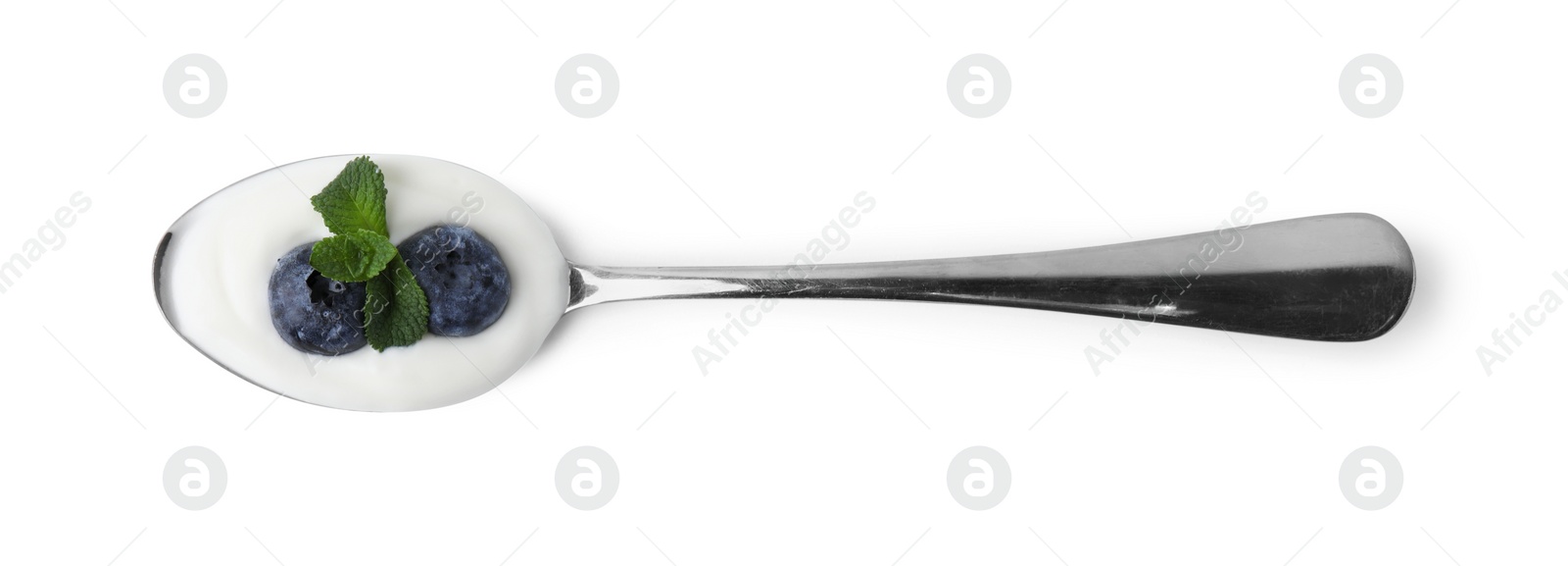 Photo of Spoon with yogurt, blueberries and mint isolated on white, top view