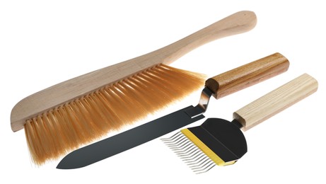 Photo of Brush, uncapping fork and knife on white background. Beekeeping tools