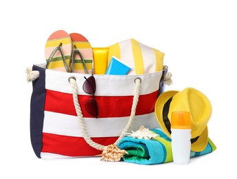 Stylish bag with beach accessories isolated on white