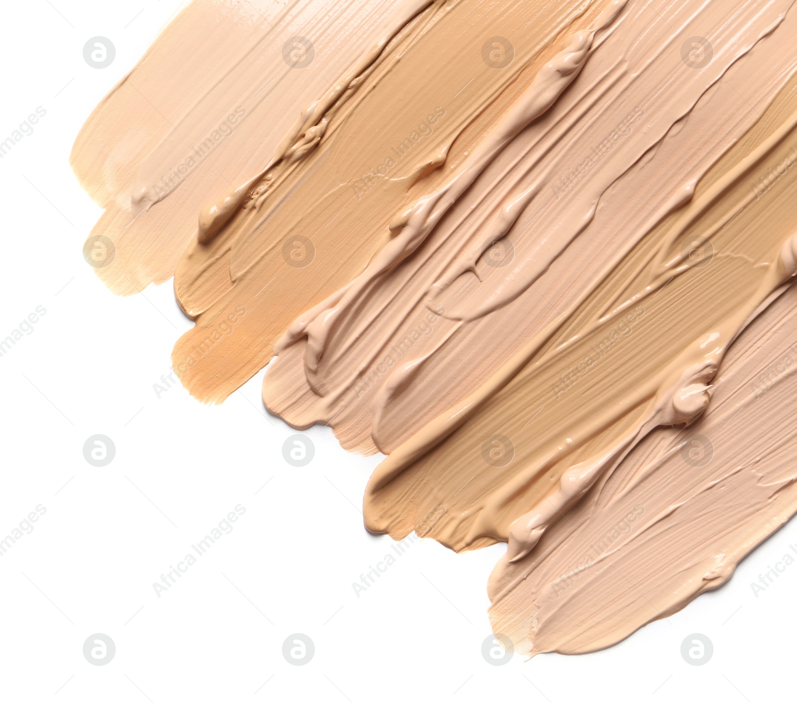 Photo of Samples of skin foundation on white background, top view. Space for text