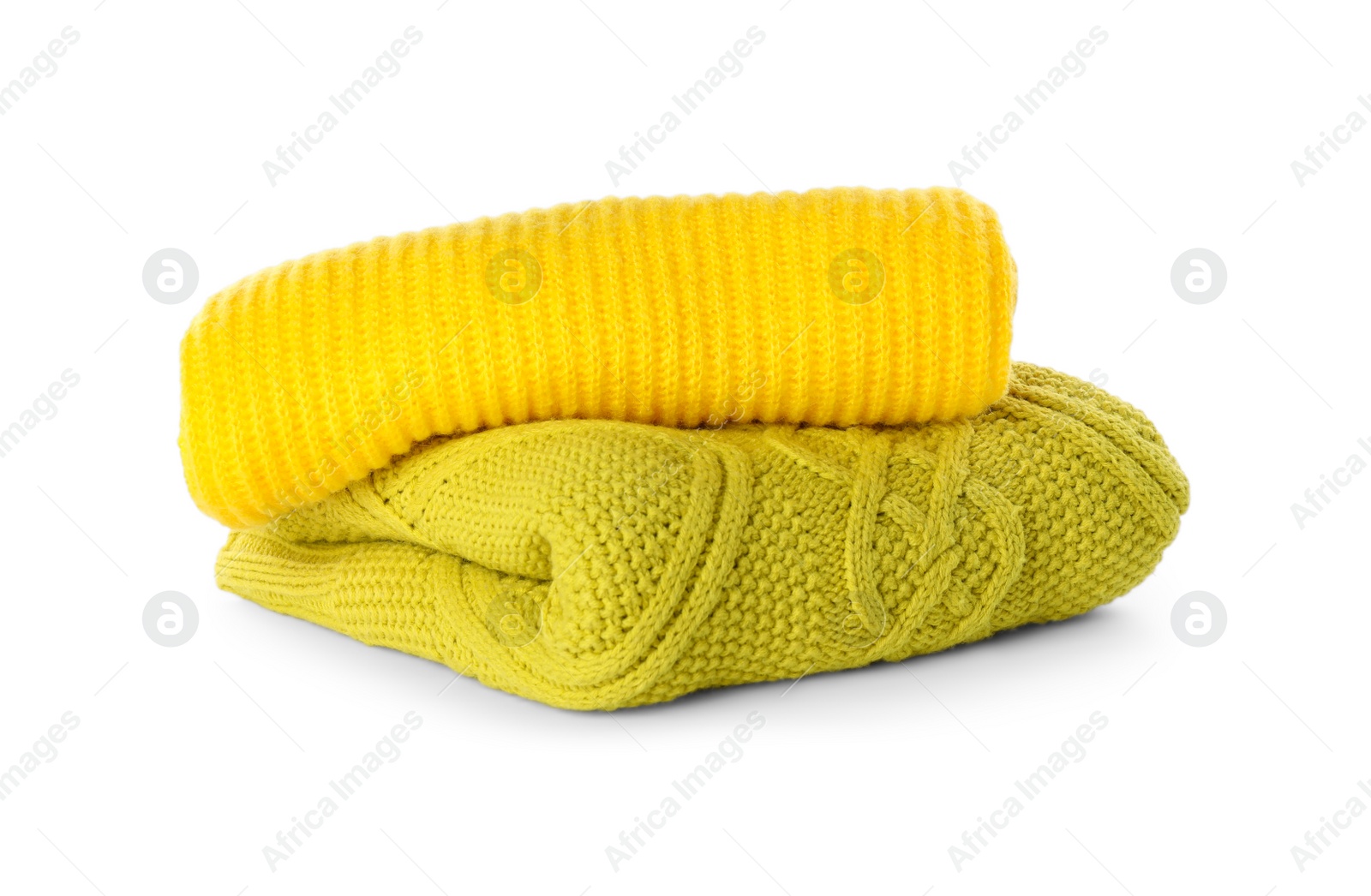 Photo of Stack of different warm sweaters isolated on white