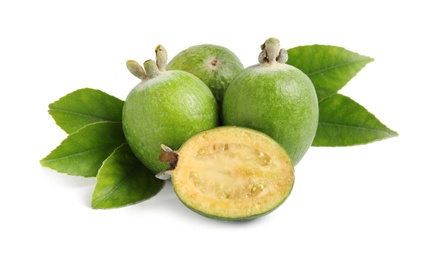 Photo of Whole and cut feijoa fruits on white background