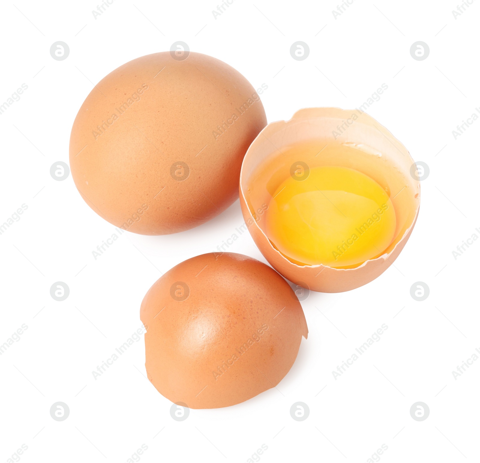 Photo of Whole and cracked chicken eggs isolated on white