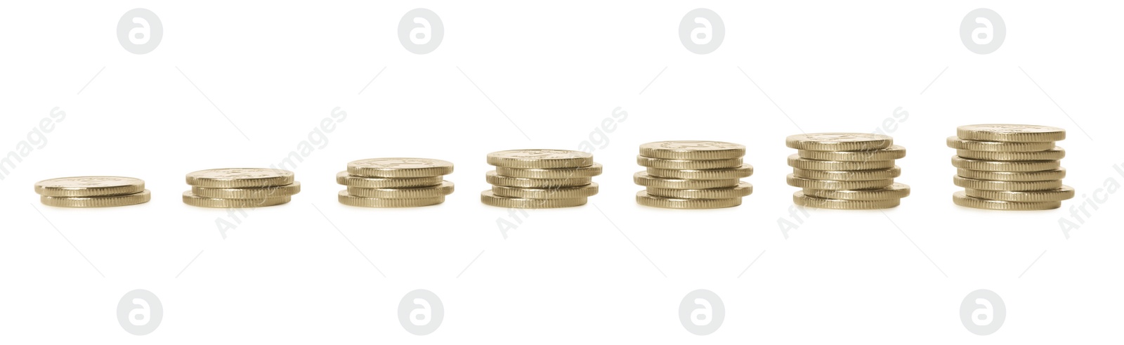 Photo of Stacked coins on white background. Investment concept