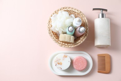 Bath accessories. Flat lay composition with personal care products on pink background, space for text