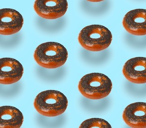 Image of Pattern design with levitating fresh bagels on light blue background