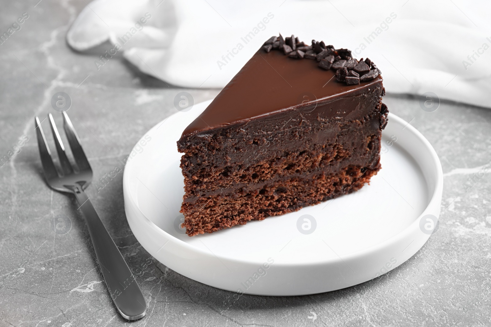 Photo of Delicious fresh chocolate cake served on grey table