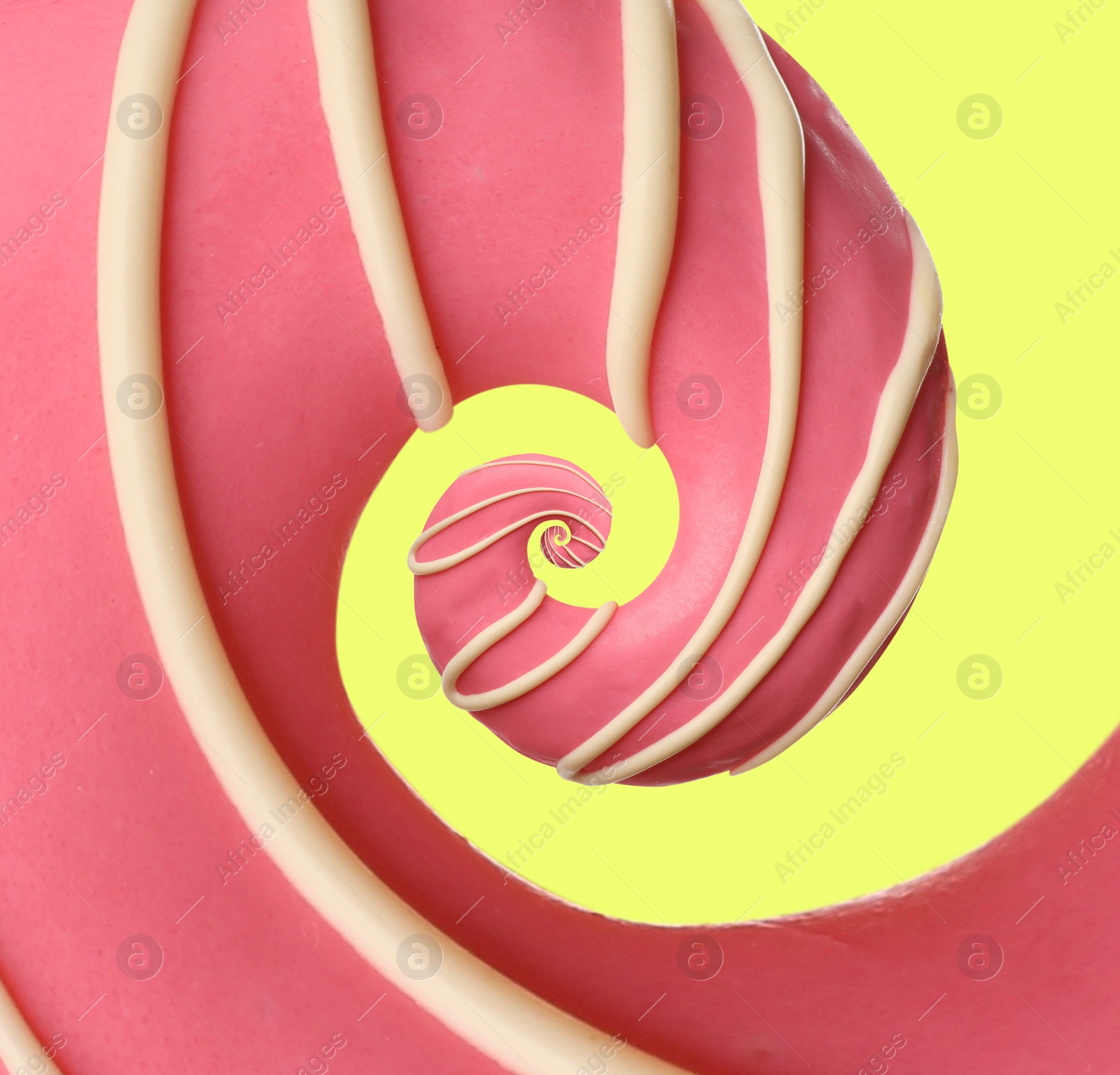 Image of Twisted donut with strawberry icing and topping on light yellow background, spiral effect