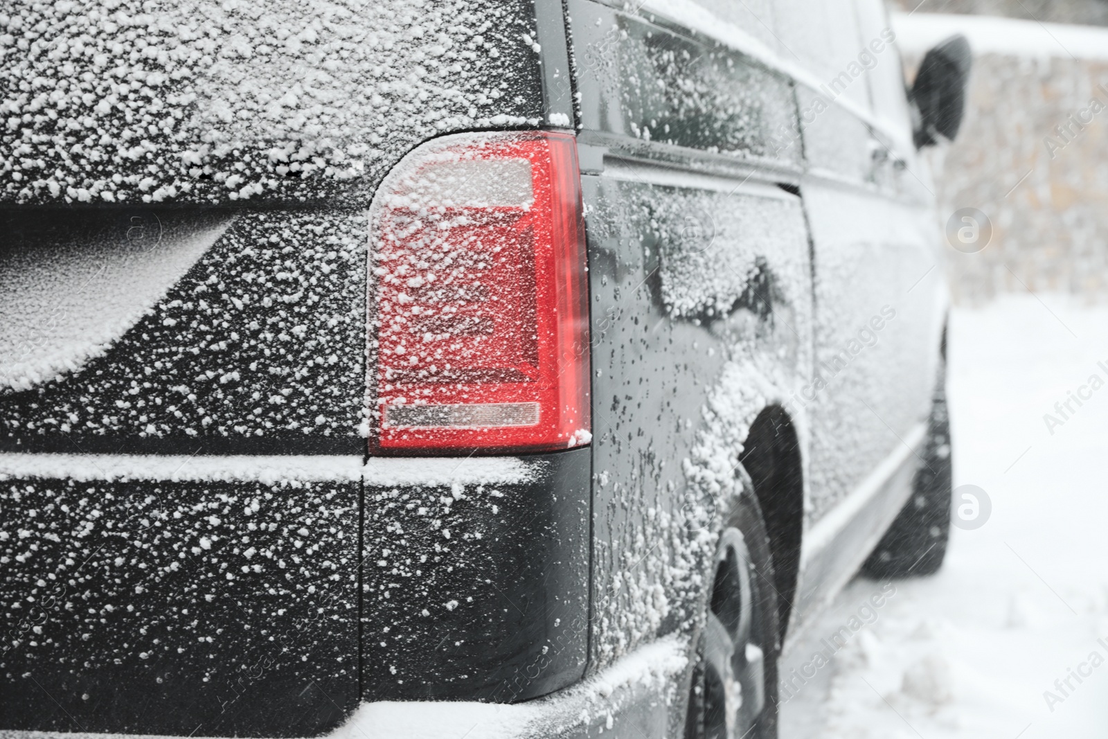 Photo of Closeup view of car on snowy country road