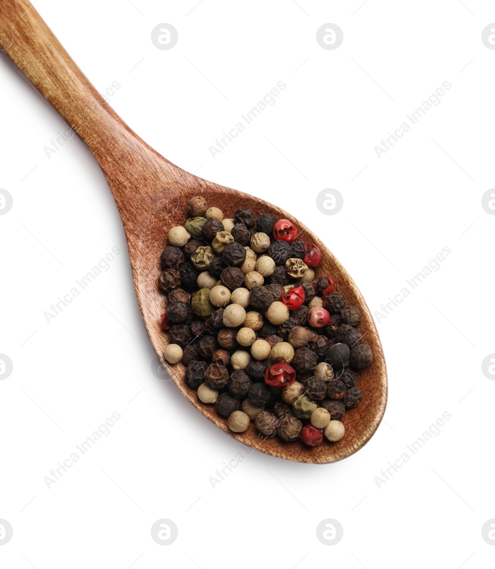 Photo of Aromatic spices. Different peppers in wooden spoon isolated on white, top view