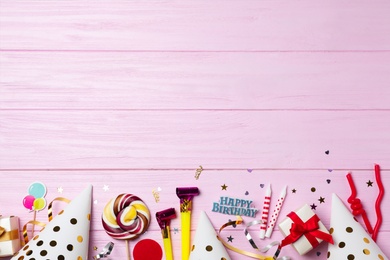 Flat lay composition with birthday party items on wooden background