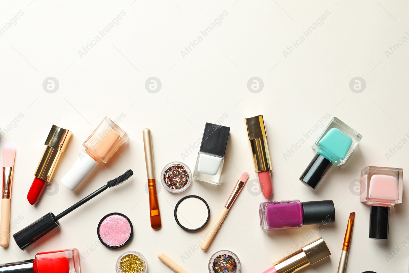 Photo of Flat lay composition with decorative cosmetics on color background