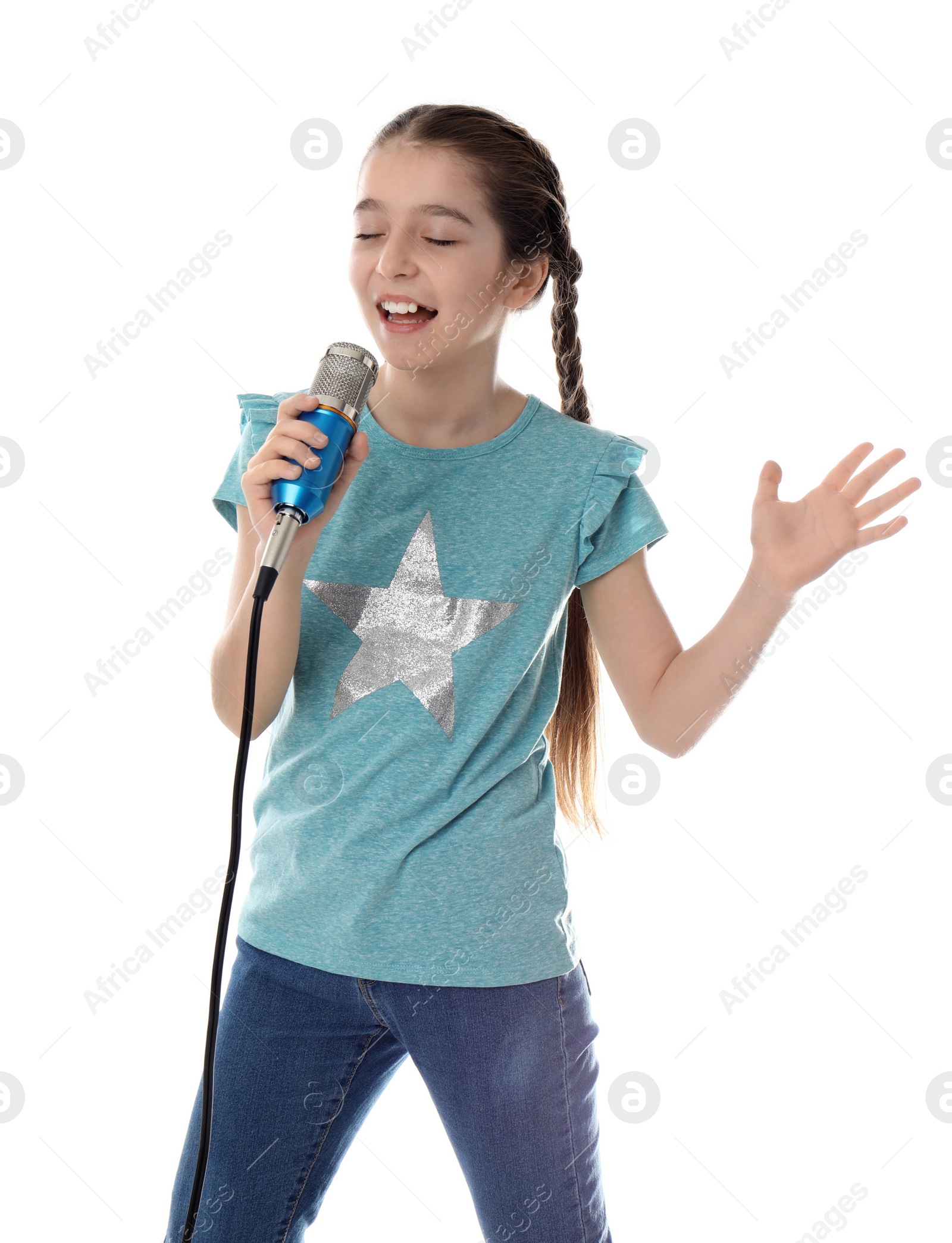 Photo of Cute girl singing in microphone on white background